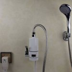 Electric instantaneous water heater connected to the shower