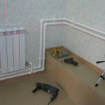 Connection of a cast iron radiator with a pipe