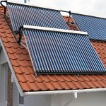 Solar collectors installed on the southern slope of the roof of a private house